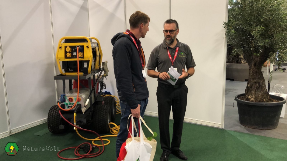 weed control advisor explaining how the electric spot weeder kills weeds using electricity