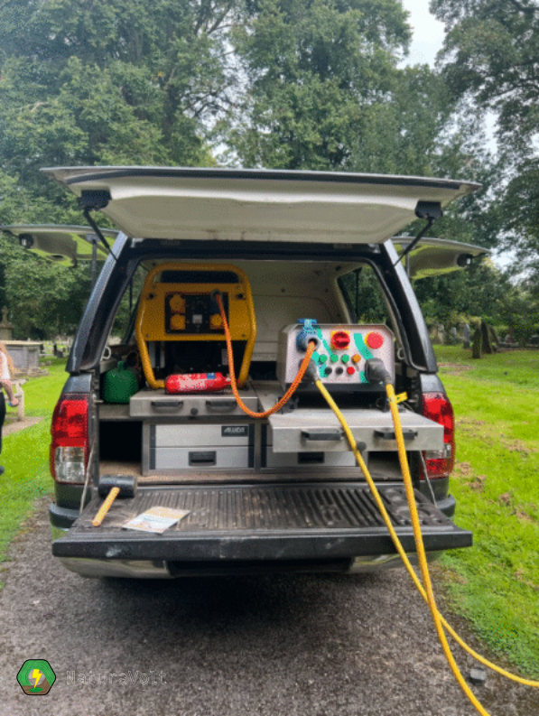 Units of the electric spot weeder displayed in the back of a truck